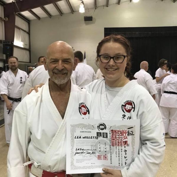 Lea Willette after receiving 1st Kyu promotion with Hanshi Ader